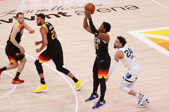 Donovan Mitchell (45) drills a three pointer over Memphis' Dillon Brooks (24)